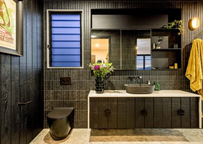 Breezway Louvres with frosted blades in dark frame and standard handle are great for bathrooms