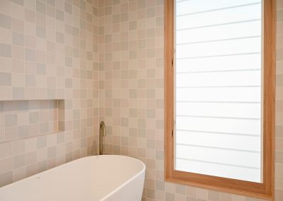 Use Breezway Louvres with frosted blades in a DECO powdercoated frame for privacy