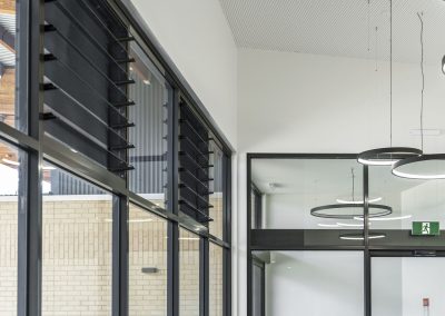 Multiple bays of Breezway Powerlouvres and Fixed Lite Glazing