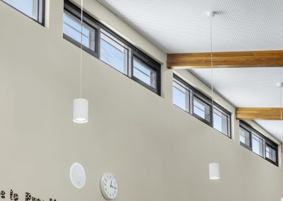 Multiple bays of the Breezway Powerlouvre System up high to naturally ventilate classrooms