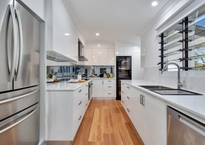 Close up of Breezway Louvres with standard handles in the kitchen