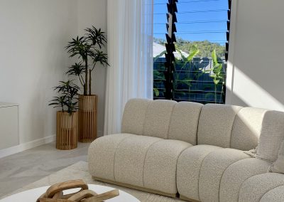 Lounge room with Breezway Louvres inside the Ultra Living La Casa Eden Display Home