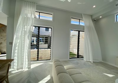 Naturally ventilated living room with Breezway Louvres inside the Ultra Living La Casa Eden Display Home