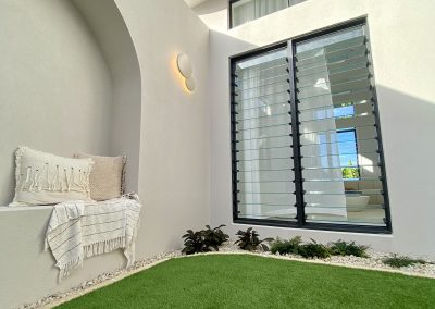 Sitting area inside the Ultra Living La Casa Eden Display Home with Breezway Louvres